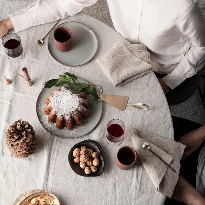 Fine cake server, brass from Ferm Living on the dining table