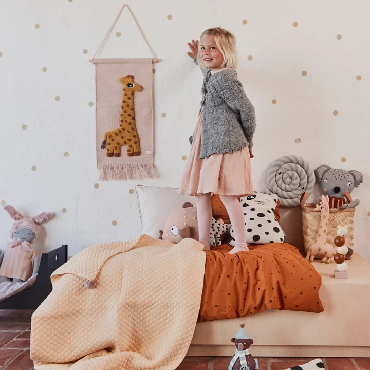 Children's tapestry with animal motif, giraffe / rose by OYOY on the wall