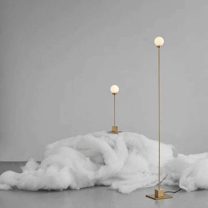 Snowball Table lamp and floor lamp in brass from Northern