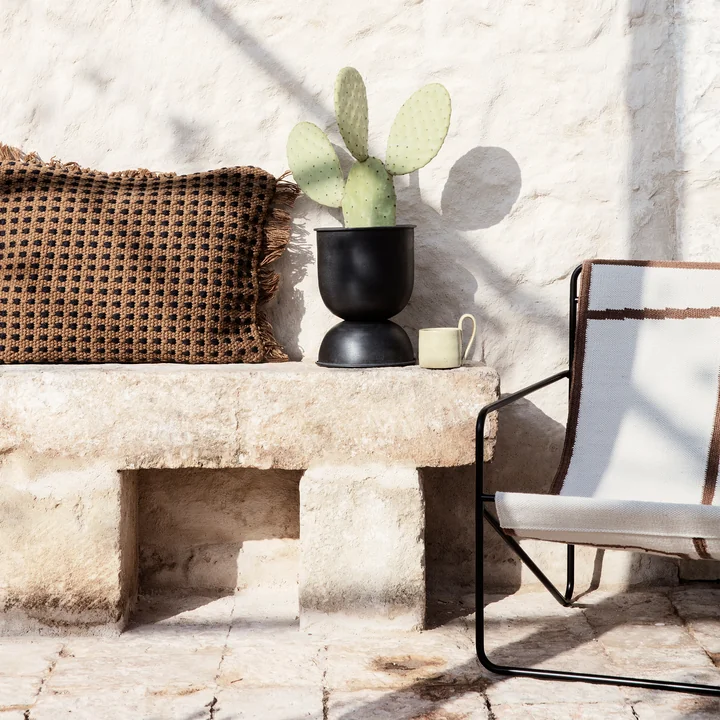 Hourglass Flower pot and desert chair from Ferm Living in the garden