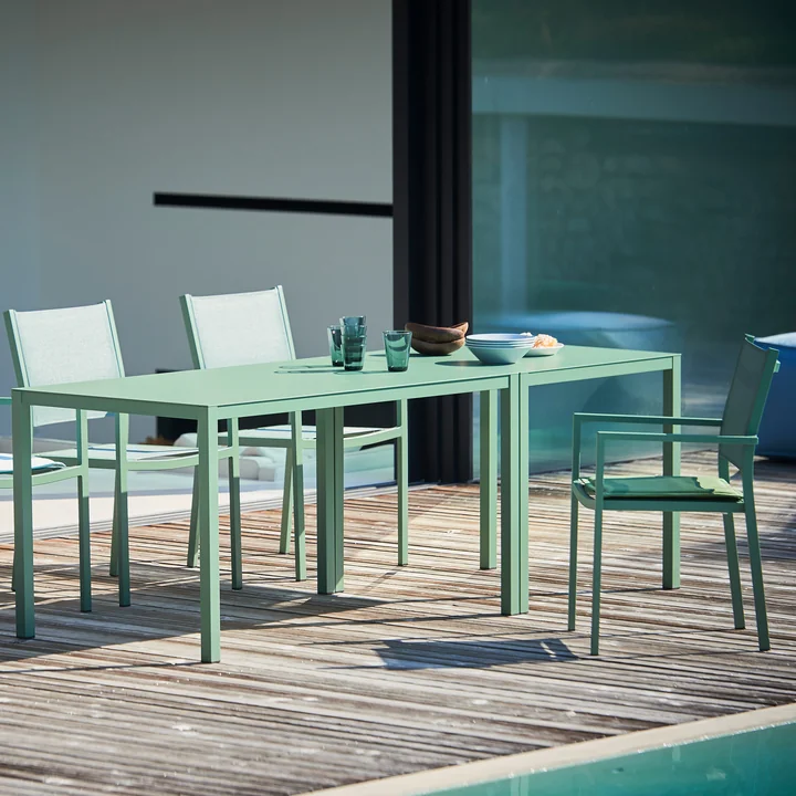 Aria Table and stacking chairs from Fiam