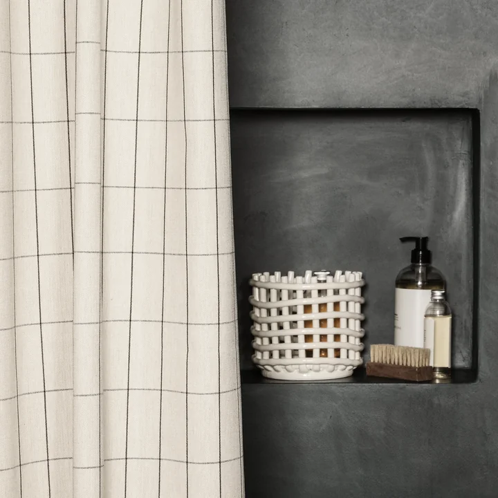 Chambray Shower curtain and the ceramic basket from Ferm Living