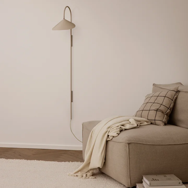 Catena sofa, Calm cushion and Arum Tall wall light from Ferm Living