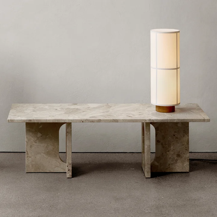 The Androgyne Lounge Table from Audo with a large table lamp