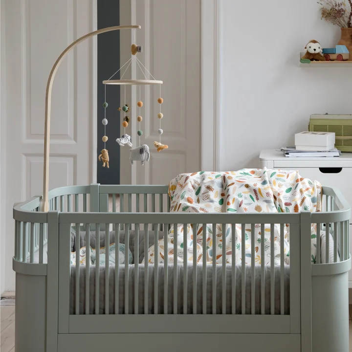 Mobile holder, baby mobile and the Sebra bed Baby & Junior from Sebra