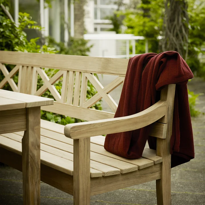 The Drachmann Bench from Skagerak at a similar outdoor dining table