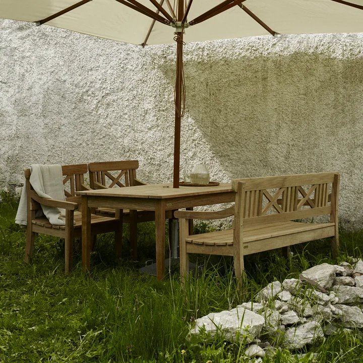 Two Drachmann Benches from Skagerak and a table under a large parasol