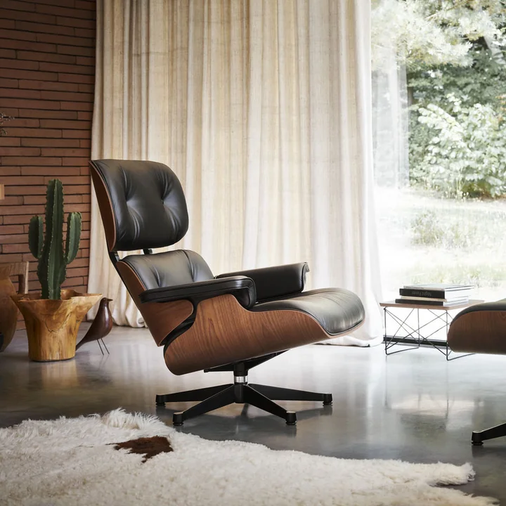 The lounge chair with ottoman from Vitra combines elegance with seating comfort