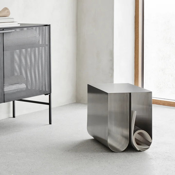 Curved side table by Kristina Dam Studio in stainless steel