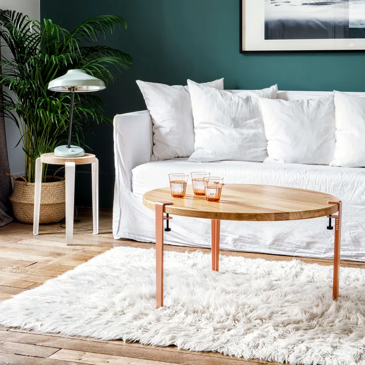 The coffee table and bench leg H 43 cm, coral pink from TipToe as a discreet focal point in the living room