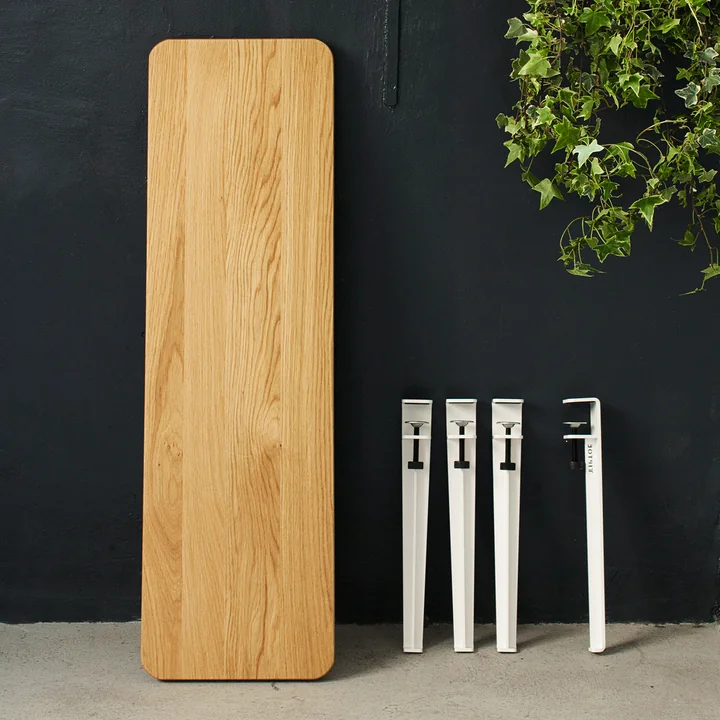 The coffee table and bench leg H 43 cm, cloudy white from TipToe next to a matching wooden table top also from TipToe