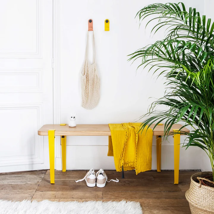 The JO wall hooks, sunflower TipToe and pink from TipToe as color accents in the hallway