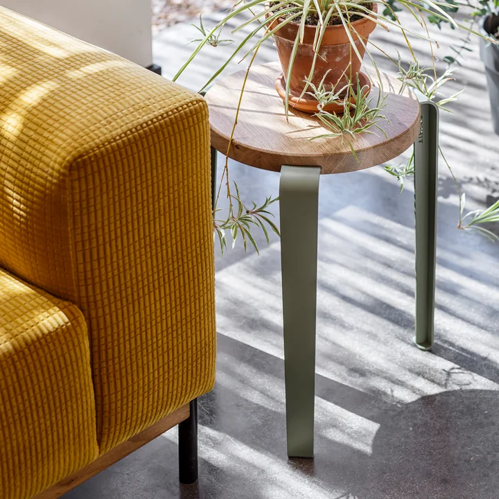 The LOU stool from TipToe as a side table next to the couch