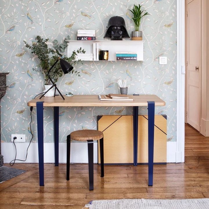 The NOMA desk, oak, mineral blue from TipToe with the LOU stool in a creative workroom.