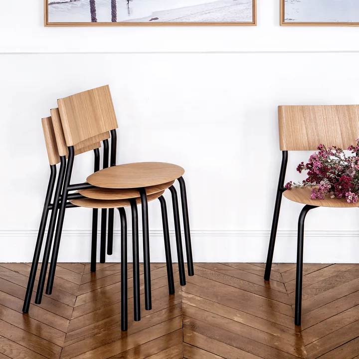 The SSD chair, oak, graphite black by TipToe in a space-saving, stacked form
