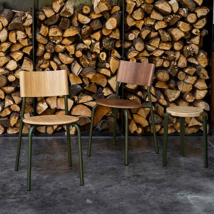 The SSD chair, oak, walnut, TipToe from TipToe in a rustic ambience with firewood