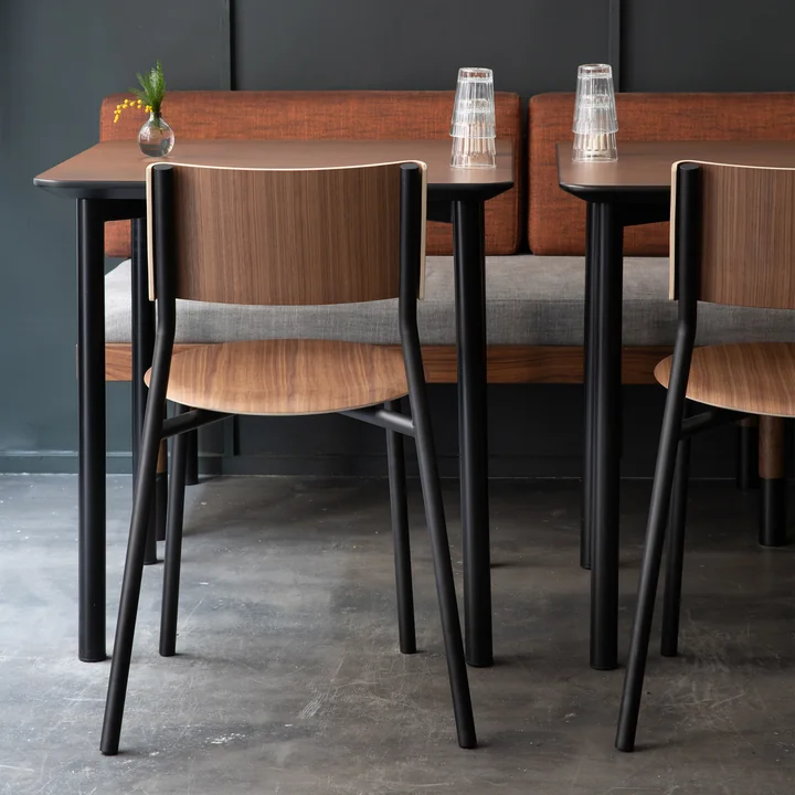 The SSD chair, walnut, graphite black from TipToe in a restaurant