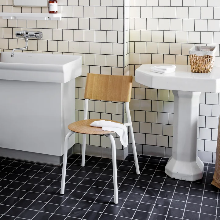 The SSD chair, oak, cloud white from TipToe as a storage location in the bathroom