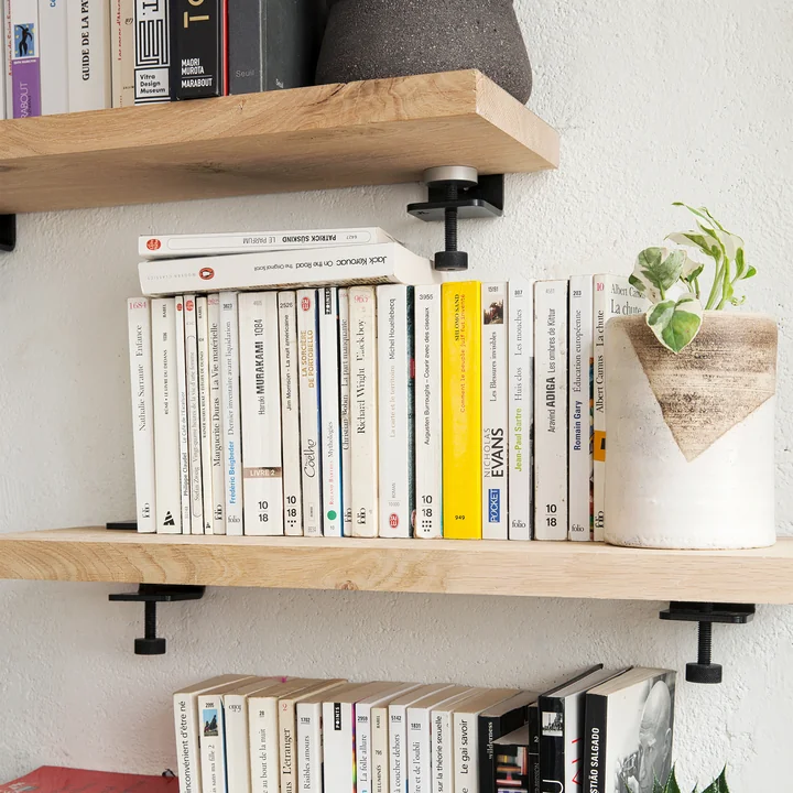 The table tops wall mount, graphite black from TipToe on a sturdy wooden shelf