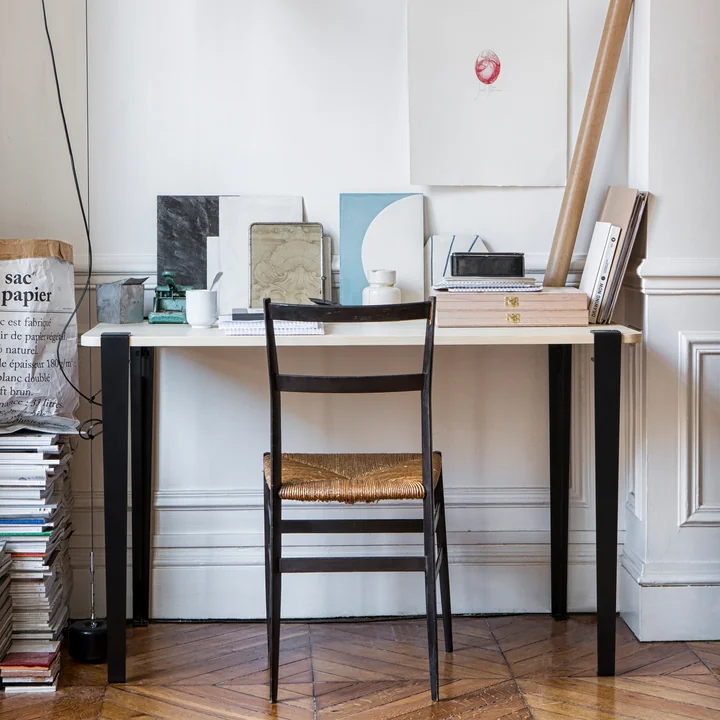 The table and desk leg H 75 cm, graphite black from TipToe at a work table in the studio