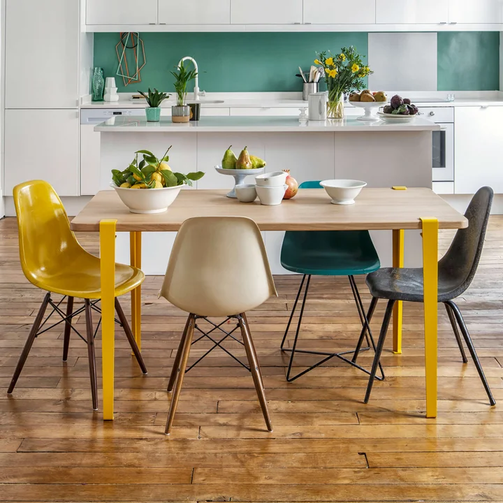 The table and desk leg H 75 cm, sunflower yellow from TipToe at a dining table in a cheerful living room kitchen