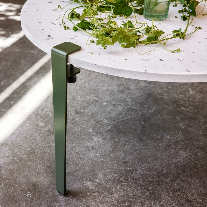The Venezia coffee table, rosemary of TipToe with green plants matching the green table legs