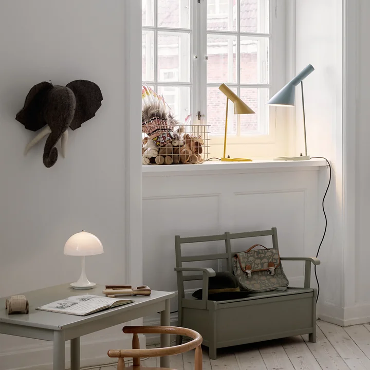 The AJ table lamp from Louis Poulsen on a windowsill in the children's room