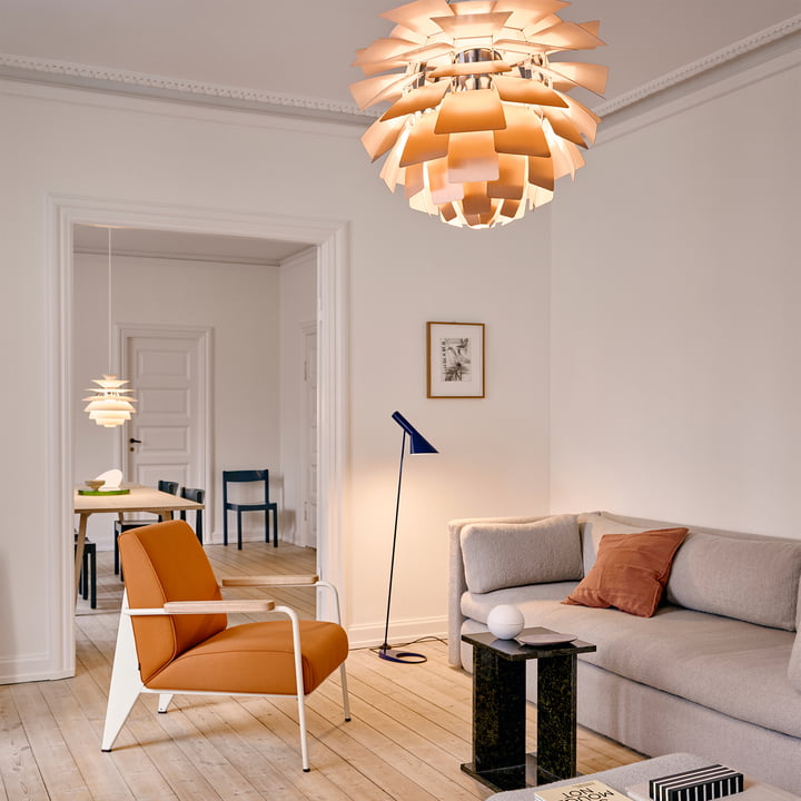 AJ floor lamp from Louis Poulsen as lighting in the cozy living room