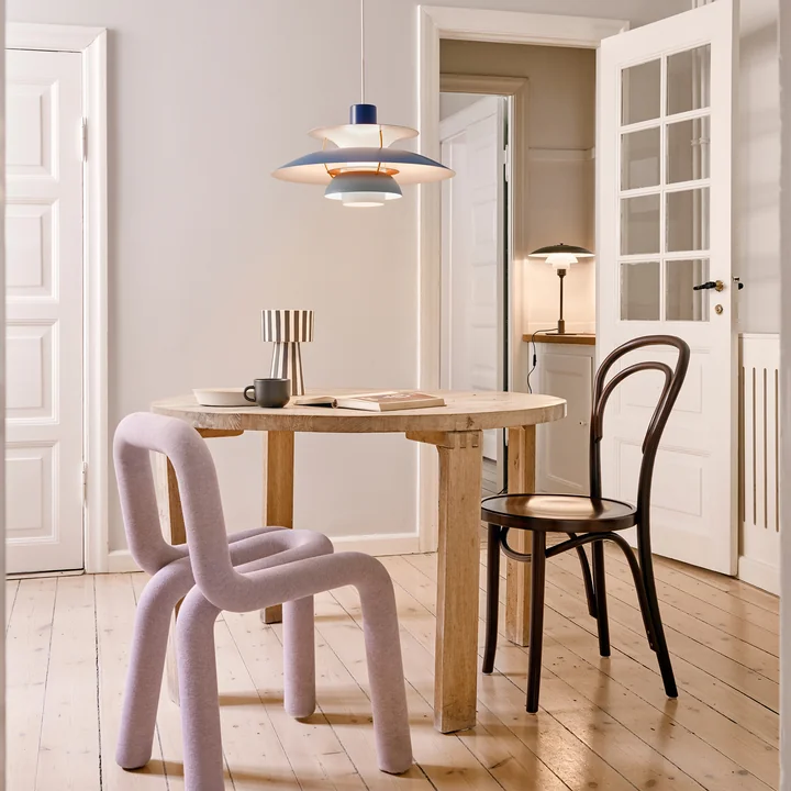 The PH 5 pendant light, hues of blue from Louis Poulsen in the cozy dining room
