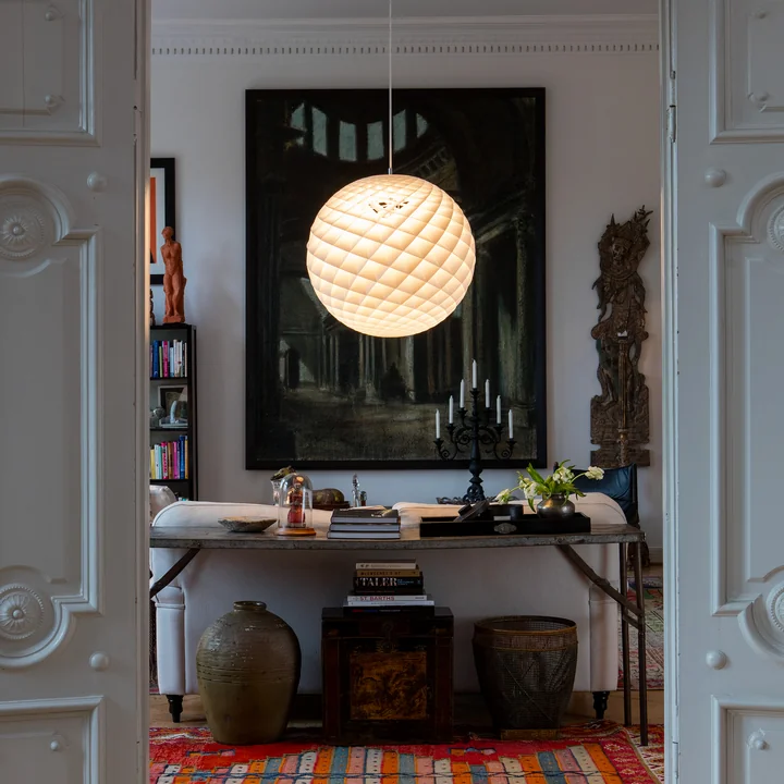 The Patera Pendant lamp from Louis Poulsen as a floating light ball in the hallway