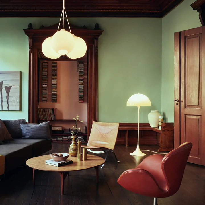 The Panthella Floor lamp, white from Louis Poulsen provides light accents in the library