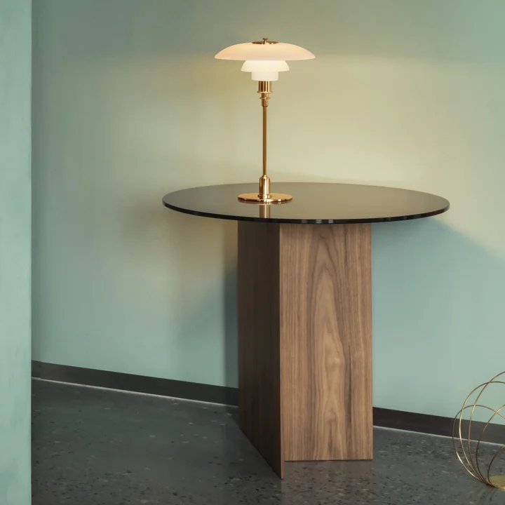 The PH table lamp, brass from Louis Poulsen on a side table in the hallway