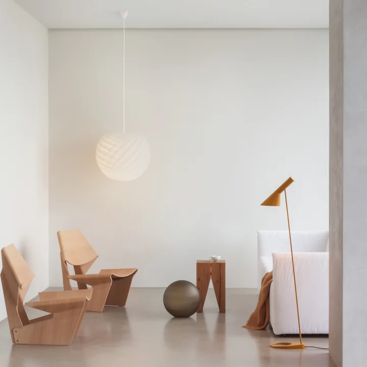 AJ floor lamp from Louis Poulsen as a functional art object in the living room