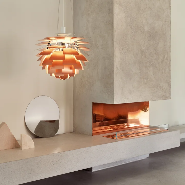 The PH Artichoke from Louis Poulsen in a modern fireplace area