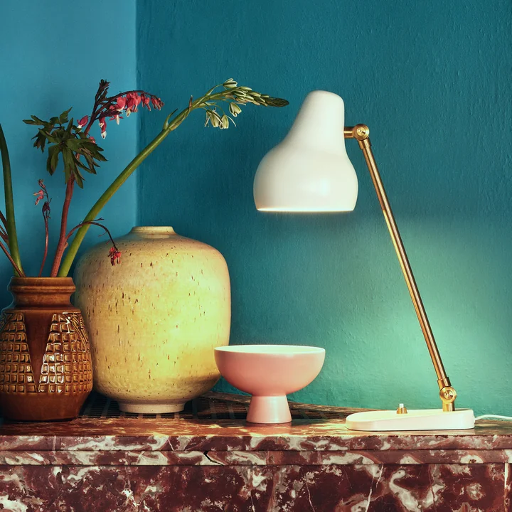 The VL table lamp from Louis Poulsen as a decorative object next to vases