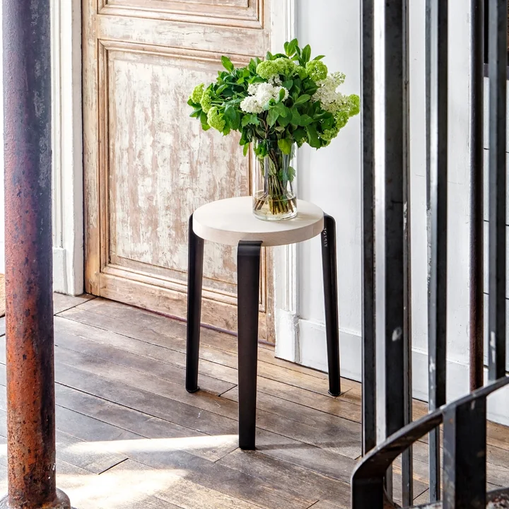 The LOU stool natural oak, graphite black from TipToe as a shelf in the hallway