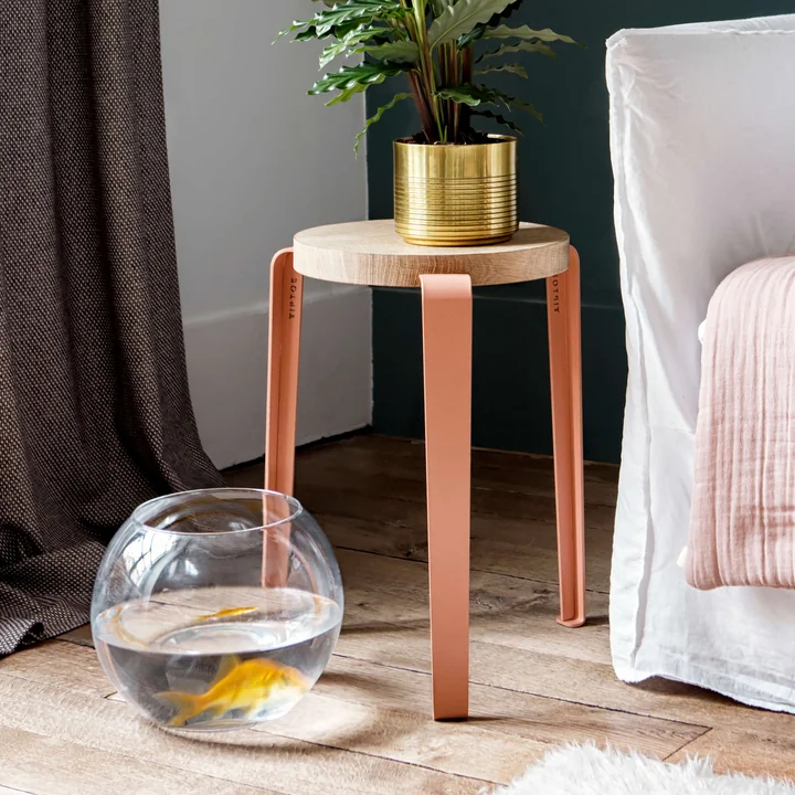 The LOU stool natural oak, coral pink from TipToe as a side table in the living room