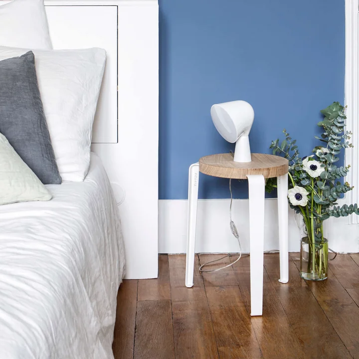 The LOU stool natural oak, cloudy white of TipToe as a bedside table in the bedroom