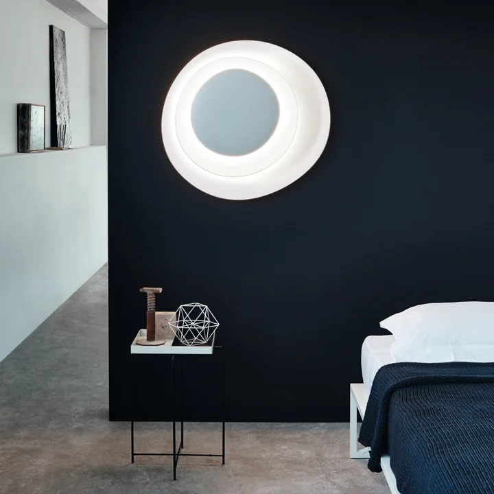 The Bahia LED wall and ceiling lamp, white (dimmable) by Foscarini in the bedroom