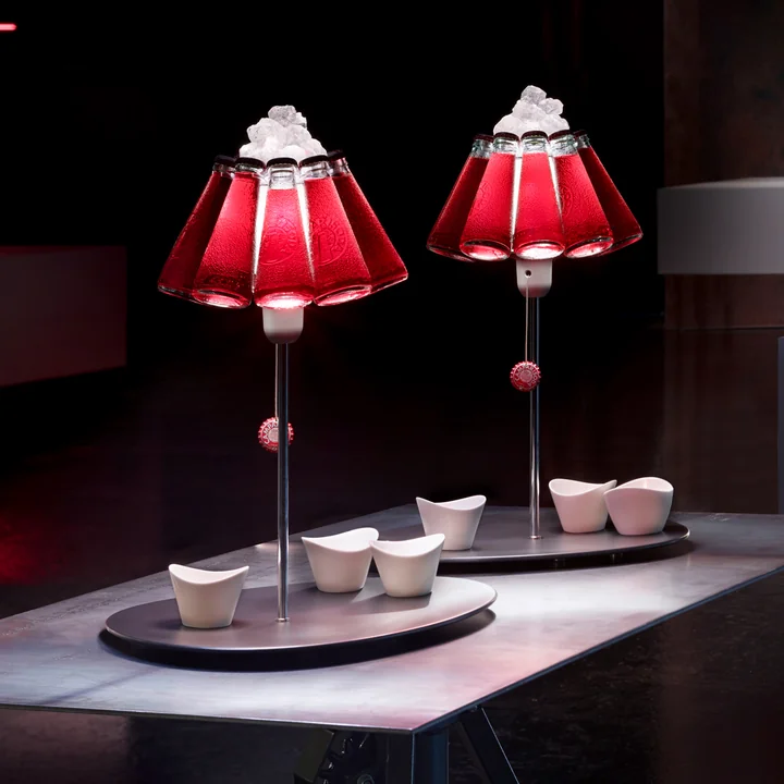 The Campari Bar table lamp, red (EU) by Ingo Maurer as a shelf for bowls
