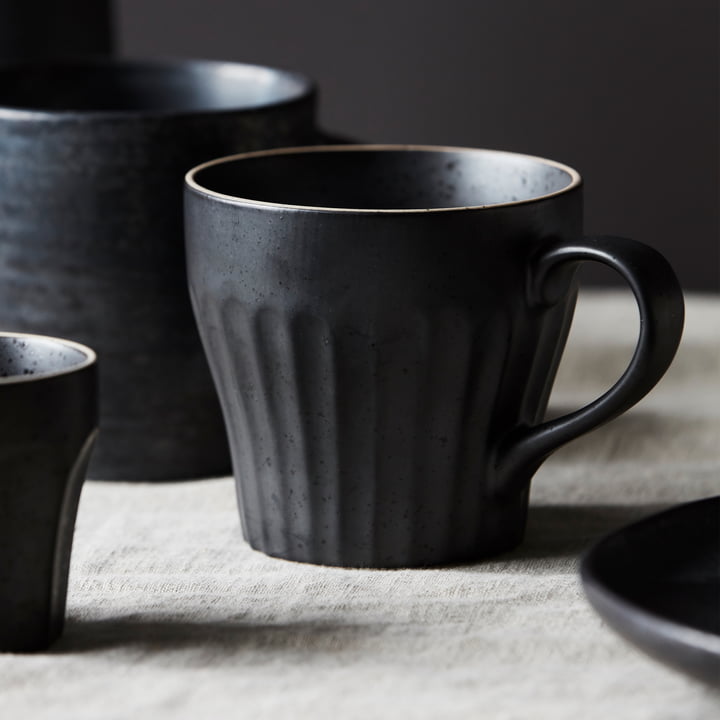 Mug with handle, Berica, black by House Doctor, surrounded by other rustic dishes