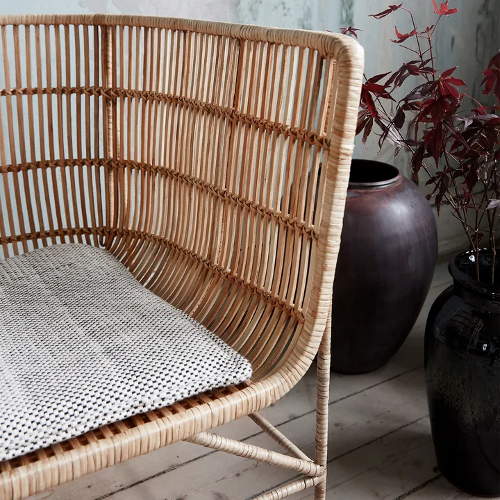 The Cuun Rattan Lounge Chair, natural by House Doctor with a seat cushion