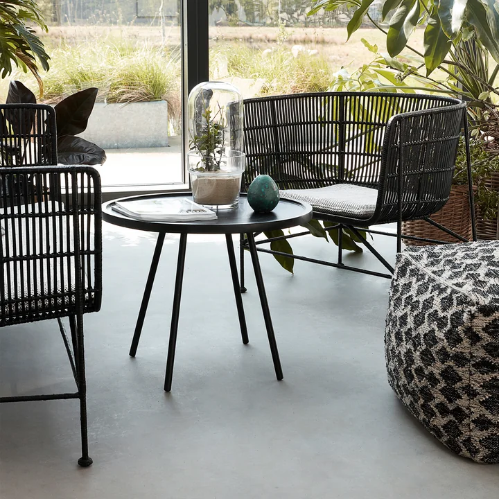 The Cuun Rattan Lounge Chair, black by House Doctor in the winter garden