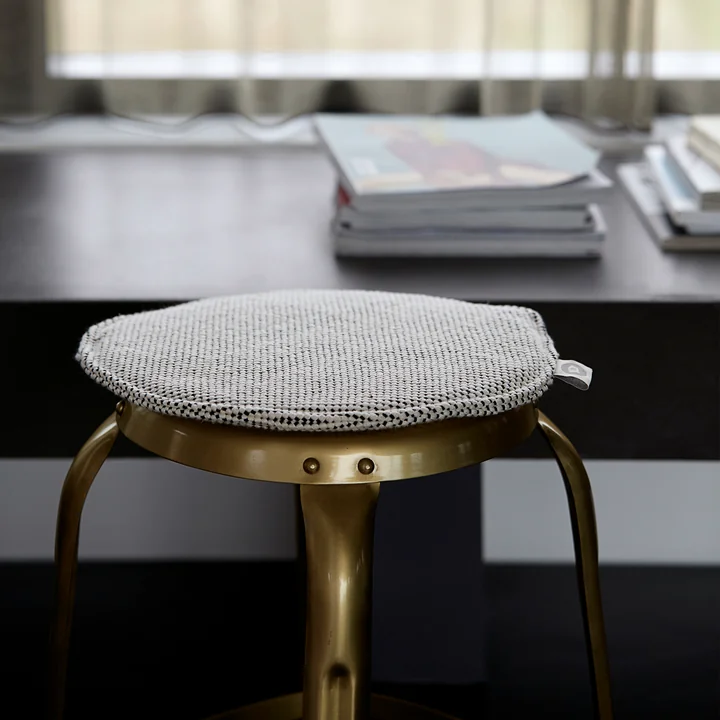 The seat cushion for Cuun rattan chair Ø 35 cm, black / white by House Doctor on a metal stool