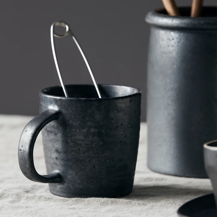 The mug with handle Pion as an utensil holder