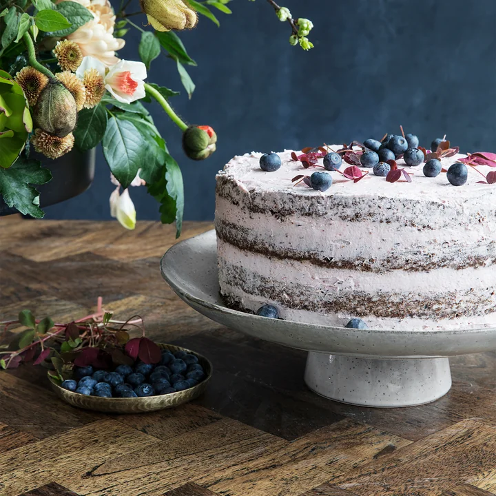 The Rustic cake plate Ø 32 cm, gray-blue by House Doctor on the decorated dining table