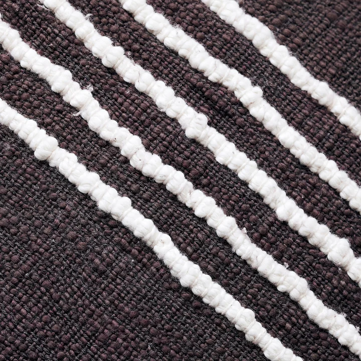 The Yarn pillowcase, brown by House Doctor has a stripe pattern in places