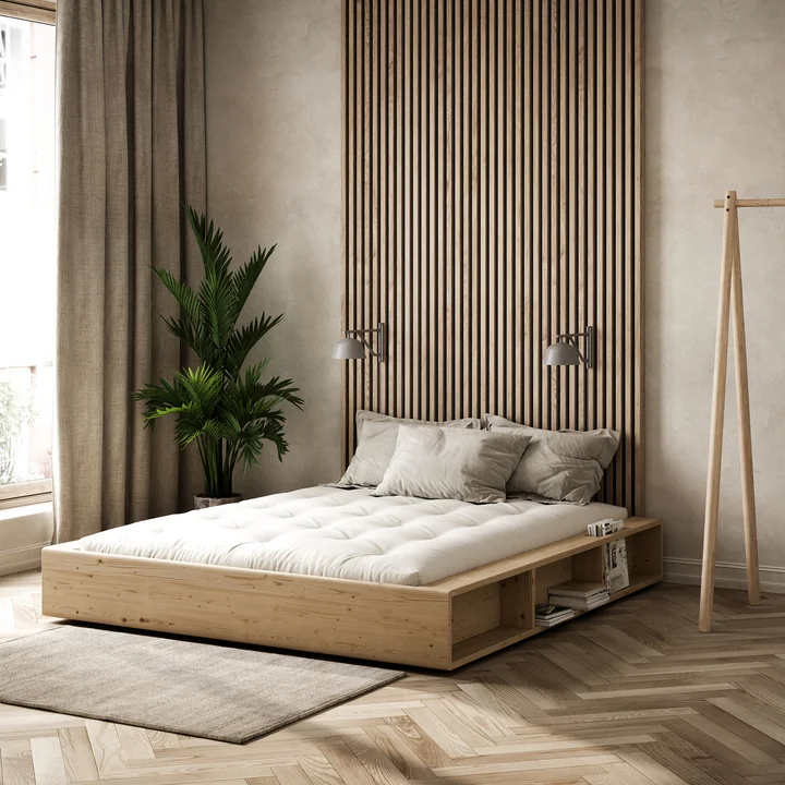 The Ziggy bedstead with slatted frame and storage of Karup Designs in the bedroom with a lot of wood