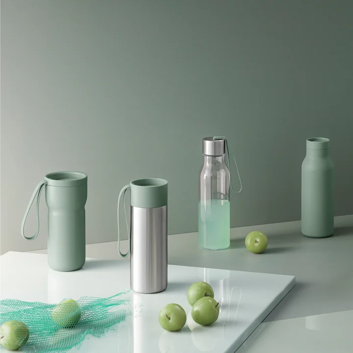 The Nordic Kitchen thermo mug in combination with other bottles and thermo containers in faded green by Eva Solo