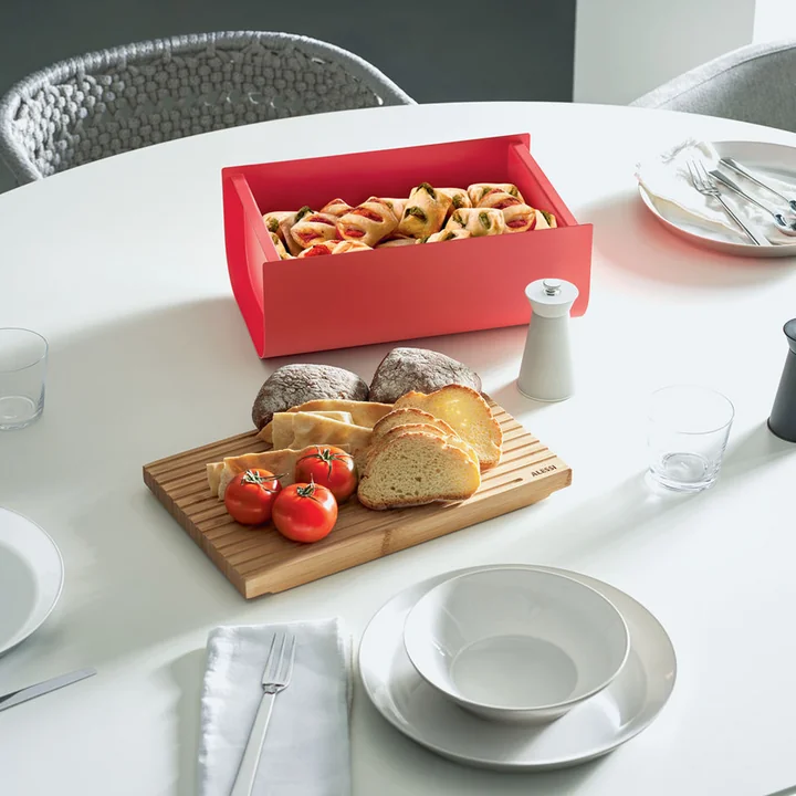 The Mattina bread box with cutting board from Alessi as a biscuit tin on the dining table